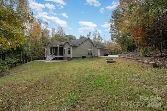 rear view of house with a lawn