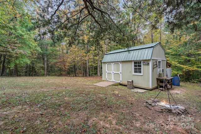 view of outbuilding featuring cooling unit