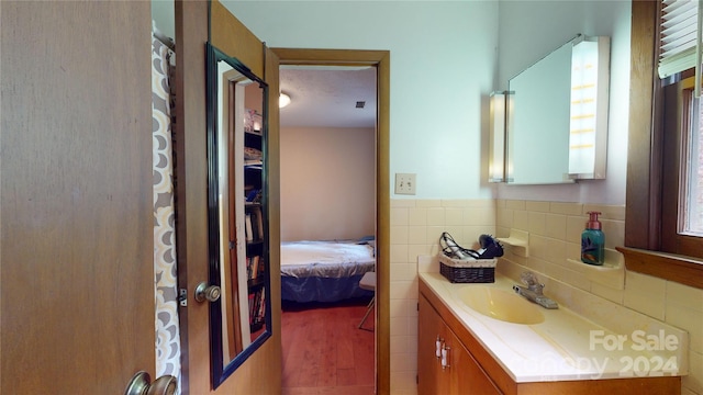 bathroom with wood-type flooring and vanity