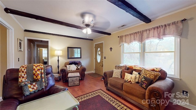 living room with hardwood / wood-style floors, ceiling fan, crown molding, and beamed ceiling