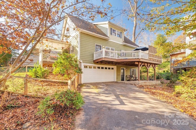 view of front of property featuring a garage and a deck