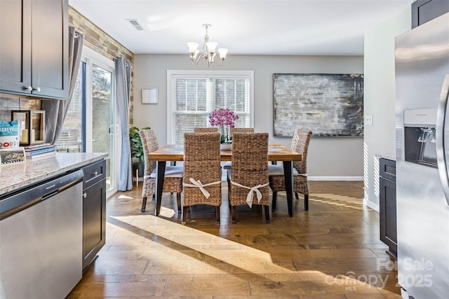 312 Jenna Clare Ln, Asheville, NC 28803 - dining area featuring dark wood-style flooring, a chandelier, and baseboards