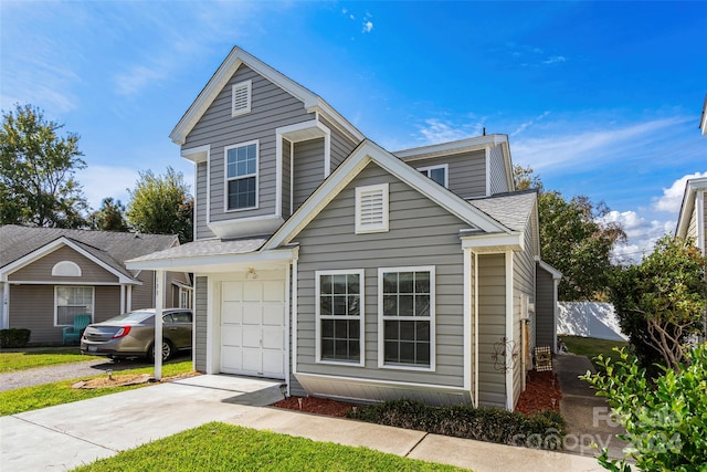 front of property with a garage