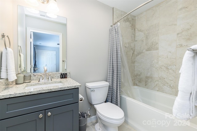 full bathroom featuring shower / bath combo, toilet, and vanity