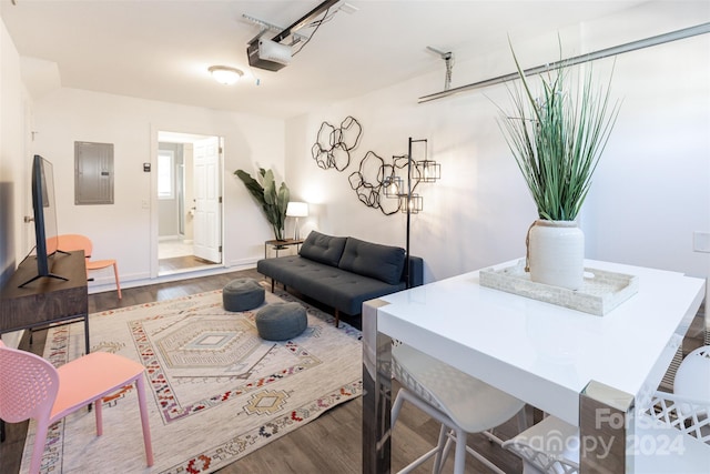 living room with hardwood / wood-style floors and electric panel