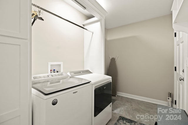 washroom with washer and dryer