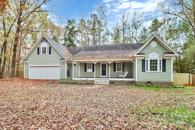 single story home featuring a garage and a porch