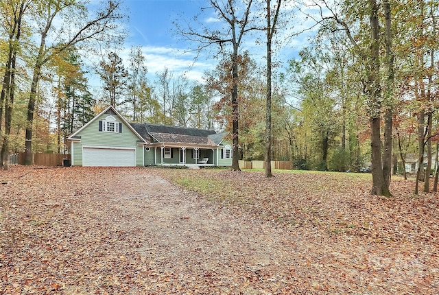 view of front of home featuring a garage and a porch