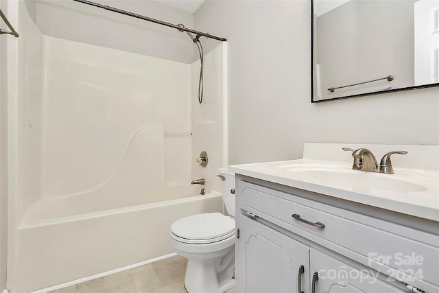 full bathroom with shower / washtub combination, vanity, tile patterned floors, and toilet