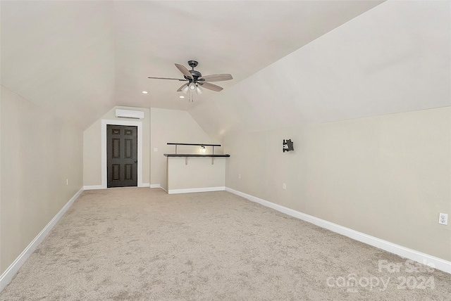 bonus room featuring a wall unit AC, lofted ceiling, ceiling fan, and carpet floors