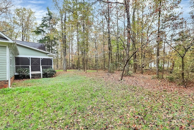 view of yard with a sunroom