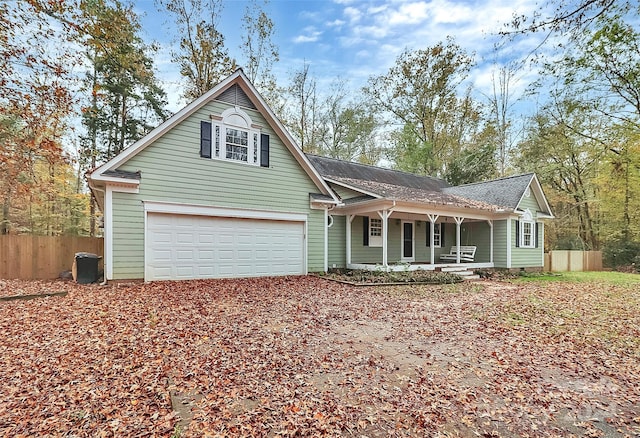 view of front of house with a garage and a porch