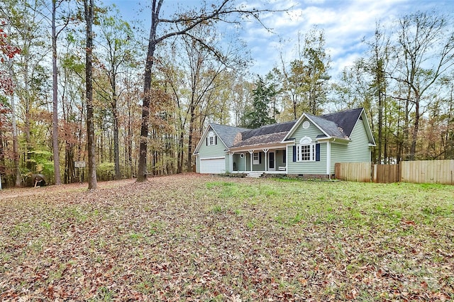 view of front of home featuring a garage and a front yard