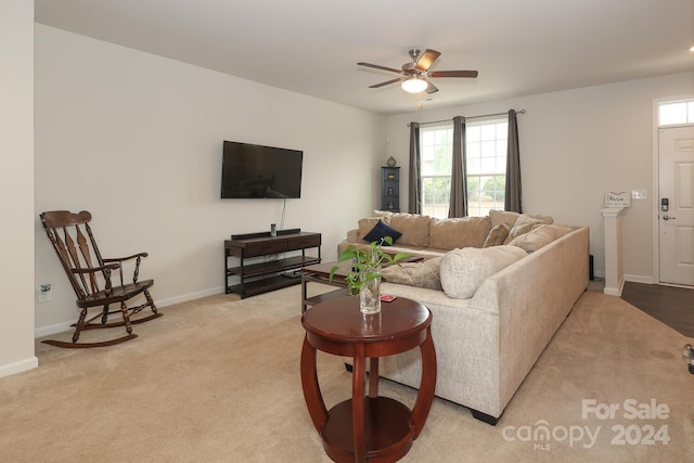 living room with light carpet and ceiling fan