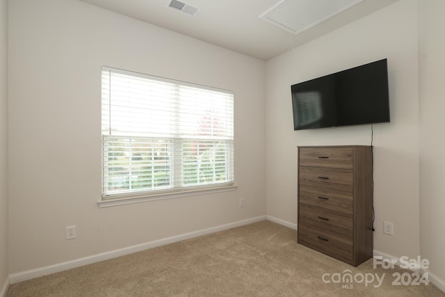 unfurnished bedroom with light colored carpet