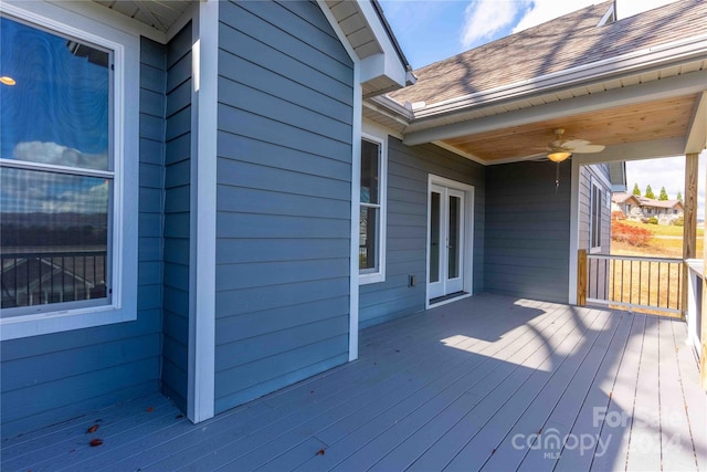 wooden terrace featuring ceiling fan