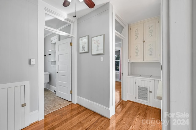 corridor with light hardwood / wood-style flooring