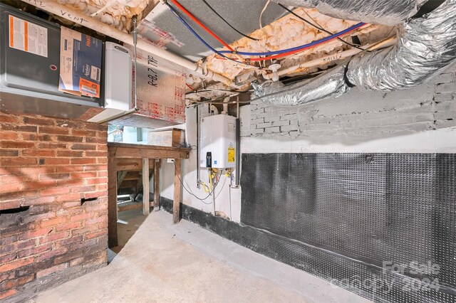 utility room featuring water heater