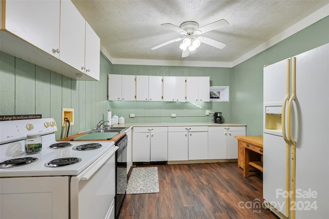 kitchen with dark wood-type flooring, white appliances, white cabinetry, and a textured ceiling