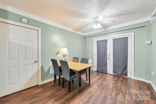 dining space featuring french doors, dark hardwood / wood-style flooring, a textured ceiling, and ceiling fan