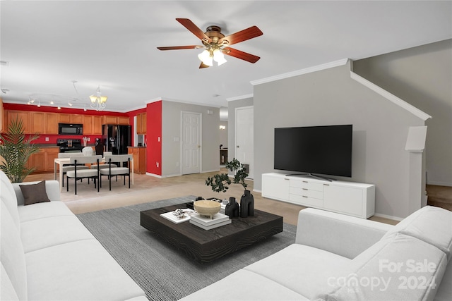 living room with crown molding and ceiling fan with notable chandelier