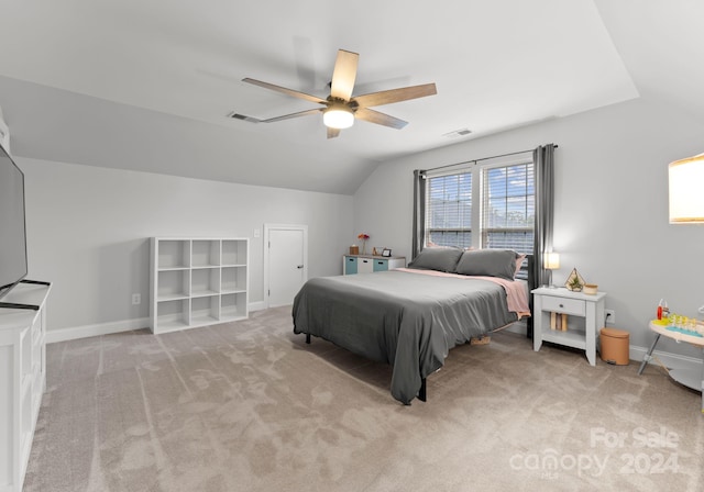 carpeted bedroom featuring ceiling fan and lofted ceiling