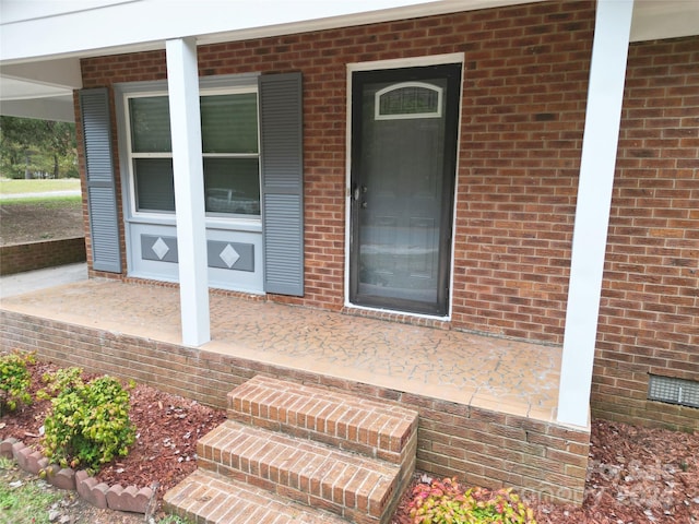 doorway to property with a patio