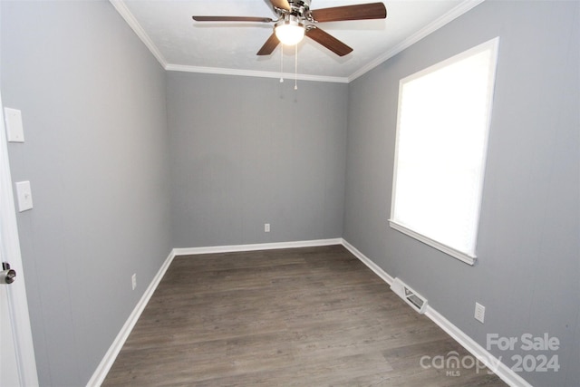 empty room featuring hardwood / wood-style flooring, ceiling fan, and crown molding