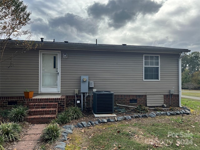 36245 Nugget Rd Unit 2, New London, NC 28127 - rear view of property with cooling unit and crawl space