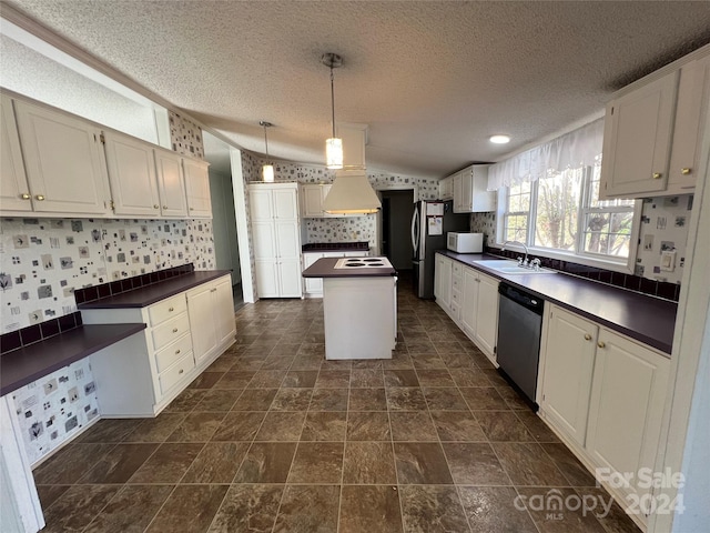 kitchen featuring a center island, stainless steel appliances, white cabinetry, and sink