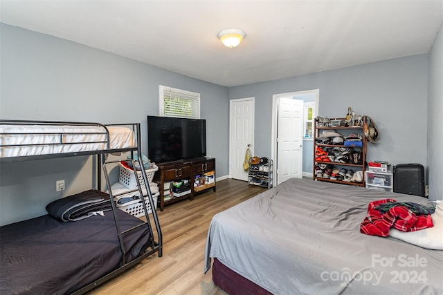 bedroom with hardwood / wood-style flooring