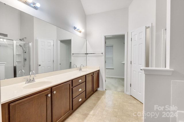 bathroom with vanity and a shower with shower door