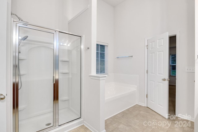 bathroom with shower with separate bathtub