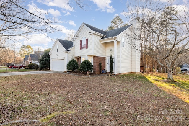 view of side of home with a garage