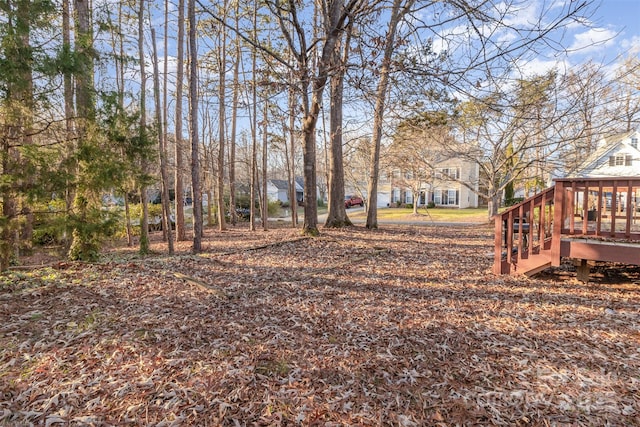 view of yard featuring a wooden deck