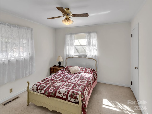 carpeted bedroom with ceiling fan