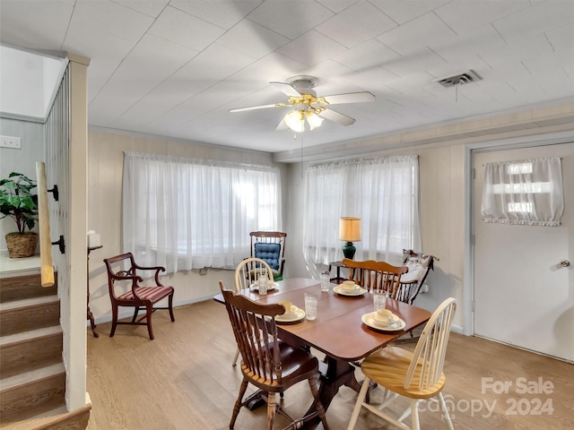 dining room featuring ceiling fan and light hardwood / wood-style flooring