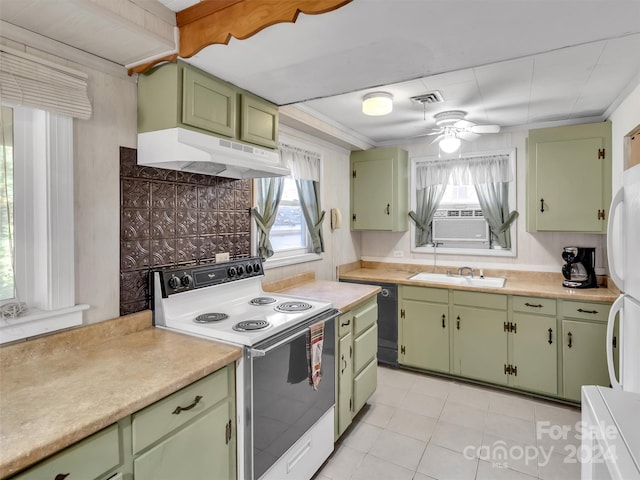 kitchen with white appliances, green cabinets, plenty of natural light, and sink