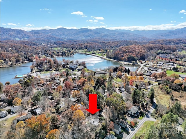 bird's eye view with a water and mountain view