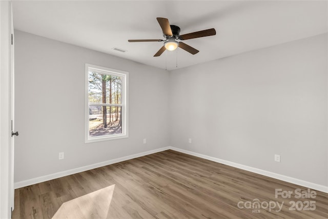 unfurnished room featuring ceiling fan and light hardwood / wood-style flooring