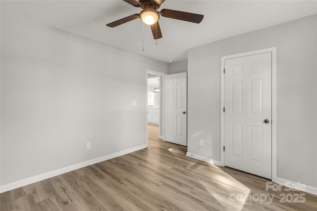 unfurnished bedroom featuring ceiling fan and light hardwood / wood-style floors