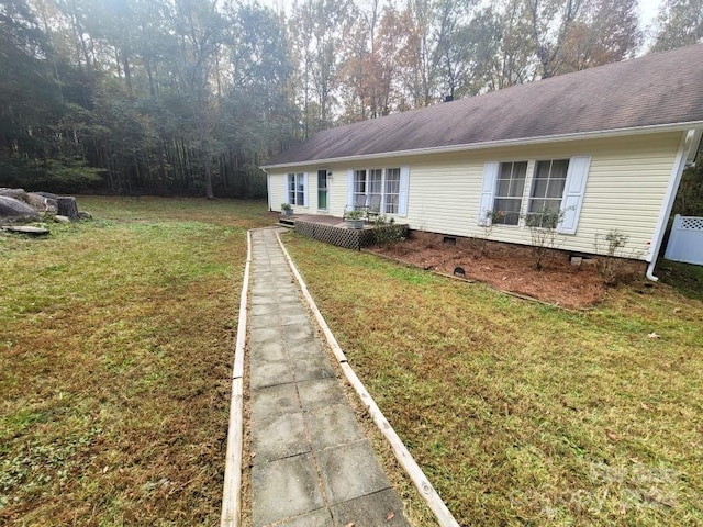 view of property exterior with a lawn