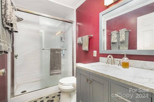 bathroom with walk in shower, vanity, tile patterned floors, and toilet