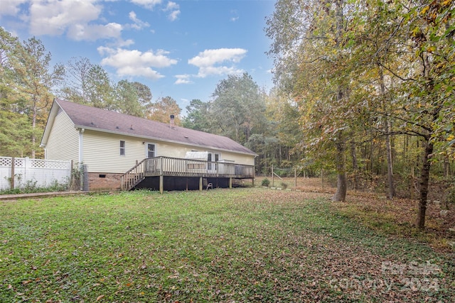 view of yard featuring a wooden deck