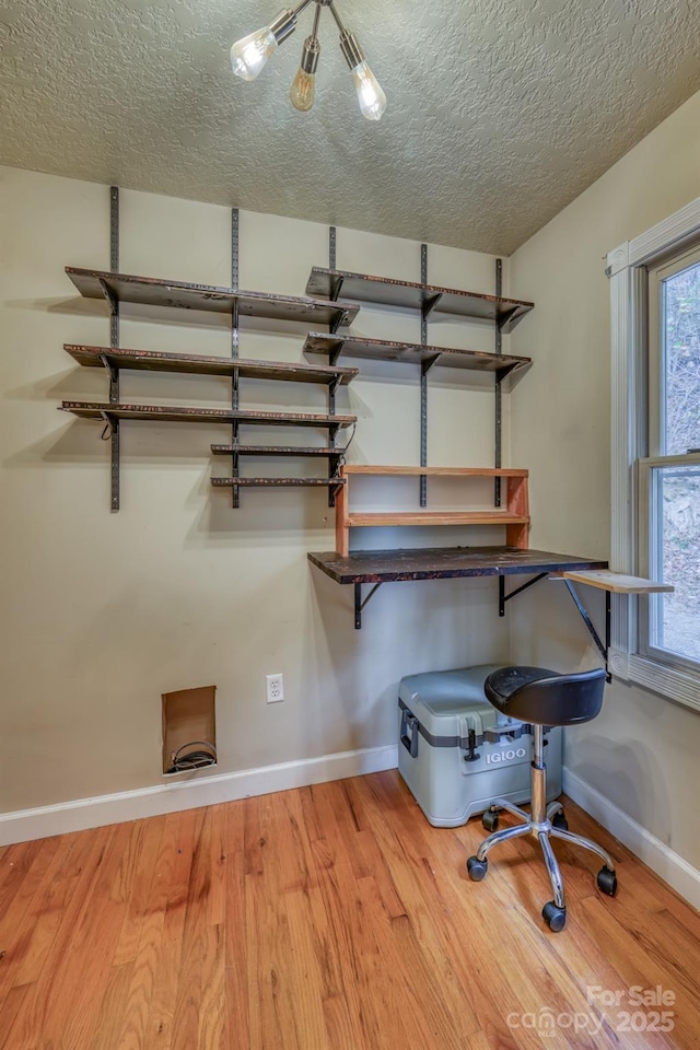 interior space with hardwood / wood-style floors and a textured ceiling