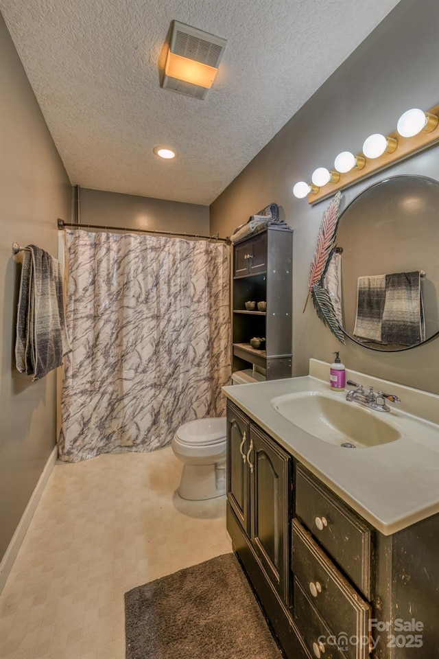 bathroom featuring a textured ceiling, toilet, vanity, and a shower with shower curtain