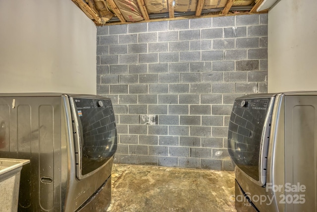 laundry area with separate washer and dryer