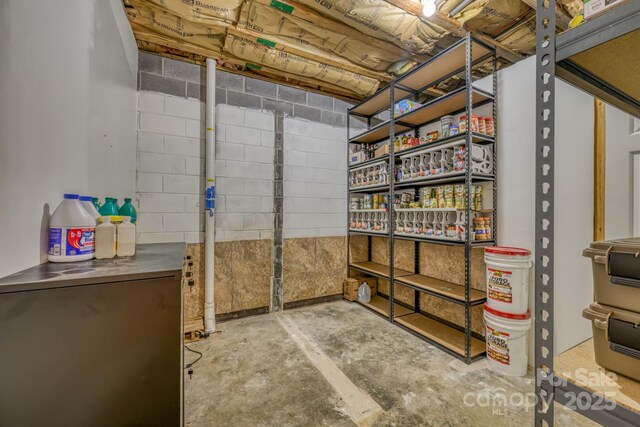 basement featuring refrigerator