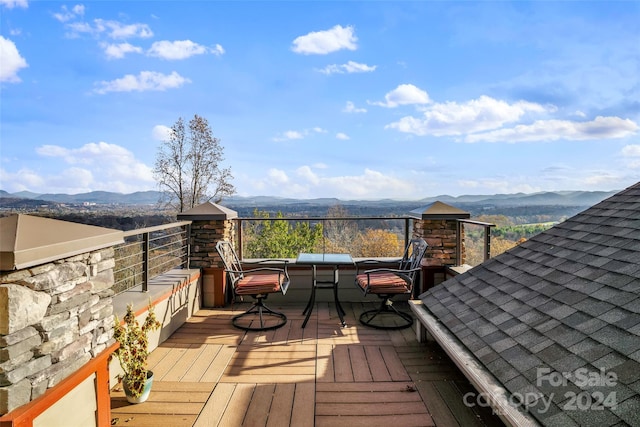 wooden deck featuring a mountain view