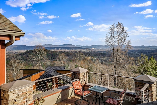 wooden deck featuring a mountain view